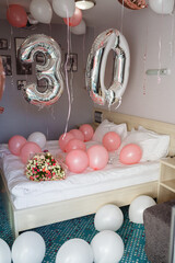 Room decorated with colorful balloons for party