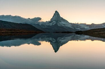 Panoramic evening view of Lake Stellisee with the Matterhorn Cervino Peak in the background....