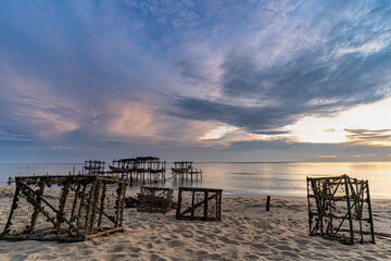 Fototapeta na wymiar Morning view before sunrise Fishing boat's harbor service at Bang Hoi Beach, Songlkhla, Thailand.