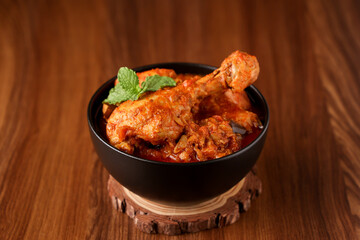 Spicy Masala Chicken curry kadai chicken curry chicken leg Kerala India SriLanka. Popular traditional North Indian non vegetarian dish for iftar Ramadan Ramzan, Eid christmas festival . Pakistani food