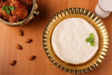 Rice pathiri, Pathir flat bread with spicy chicken curry, Kerala Tamil Nadu India SriLanka. Popular traditional South Indian breakfast dish of Malabar Muslims on Ramadan Ramzan, Eid festival Rice roti