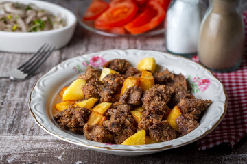 Liver pan (Albanian liver) Turkish traditional food. Liver over rice. (Turkish name; arnavut ciger)