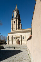 Fototapeta premium AMPUDIA, SPAIN - FEBRUARY 23, 2021: San Miguel church in Ampudia in a sunny day, Palencia, Castilla y León, Spain.