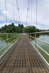 Obraz premium suspension bridge over river