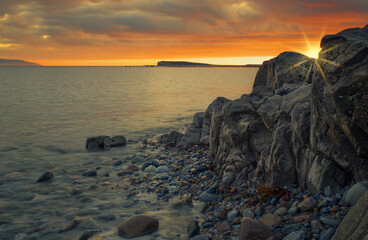 Beautiful evening orange sunset scenery at Salthill beach in Galway city, Ireland 