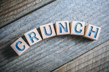 Curved Crunch Written On Wooden Blocks On A Board