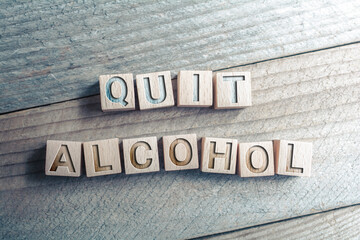 Quit Alcohol Written On Wooden Blocks On A Board - Reminder Concept