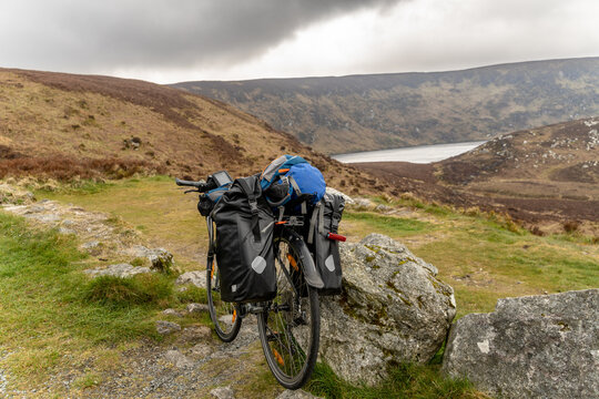 a Bike packer bike resting on mountainous landscape