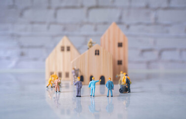 Engineering people and architecture miniature workers team working on construction helping build...