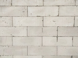 SEREMBAN, MALAYSIA -MARCH 19, 2021: Autoclaved aerated concrete block or known as AAC block used at the construction site. Install by workers using special mortar. Easy and fast.  