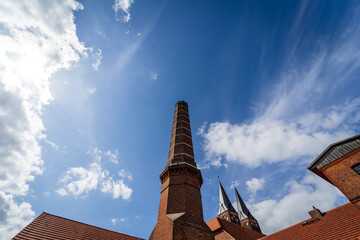 Spiers and chimneys of Jerichow Monastery, located near the shores of the Elbe River, in the state...