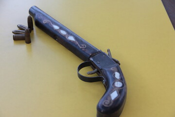 old inlaid metal and wooden weapon