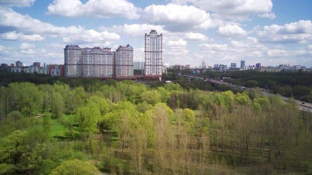 Amazing high angle top drone view on Strogino and Shchukino	district which are situated in beautiful green river park.
