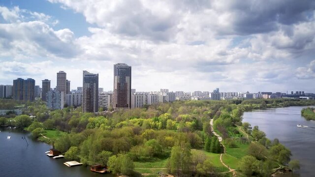 Amazing high angle top drone view on Strogino and Shchukino	district which are situated in beautiful green river park.
