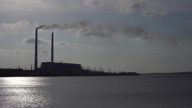 Panoramic view of power station Lukomlskaya Gres. Chimneys with smoke of power plant. Ecological problem. Environmental pollution concept.