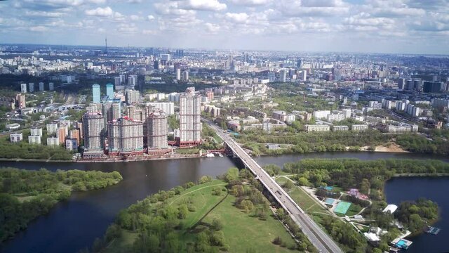 Amazing high angle top drone view on Strogino and Shchukino	district which are situated in beautiful green river park.
