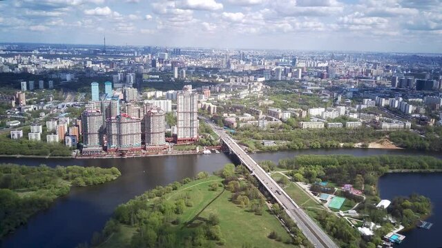 Amazing high angle top drone view on Strogino and Shchukino	district which are situated in beautiful green river park.
