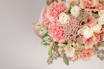 Bouquet of  soft pink flowers in pink wrapping paper.