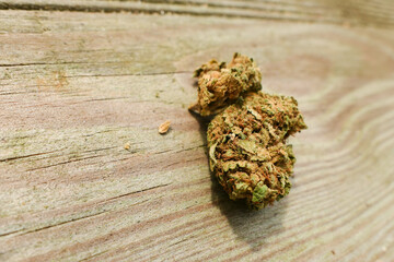 Close-up on cannabis cbd flowers. A substance containing cannabidiol for medical therapy. Focus selecitive, deliberately blurred background.