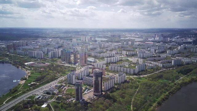 Amazing high angle top drone view on Strogino and Shchukino	district which are situated in beautiful green river park.
