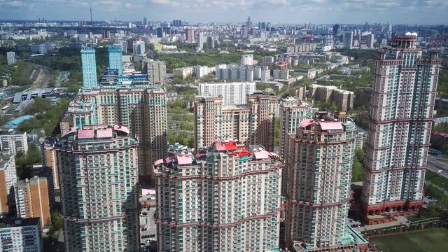 Amazing high angle top drone view on Strogino and Shchukino	district which are situated in beautiful green river park.
