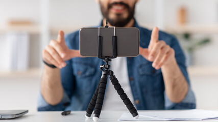 Modern devices for hobby. Unrecognizable young blogger making podcast, recording video and...