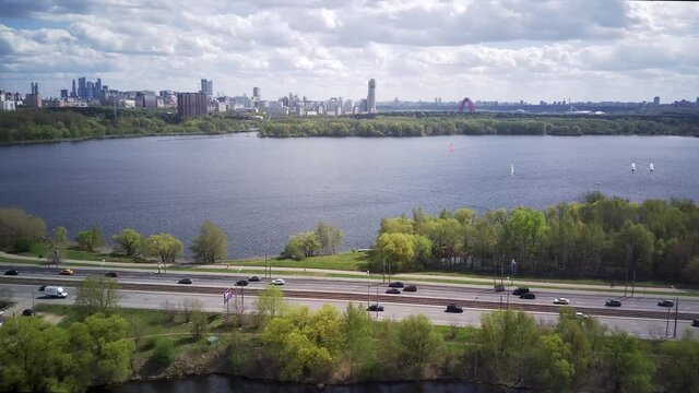 Amazing high angle top drone view on Strogino and Shchukino	district which are situated in beautiful green river park.
