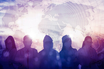 Medical workers team standing with world map