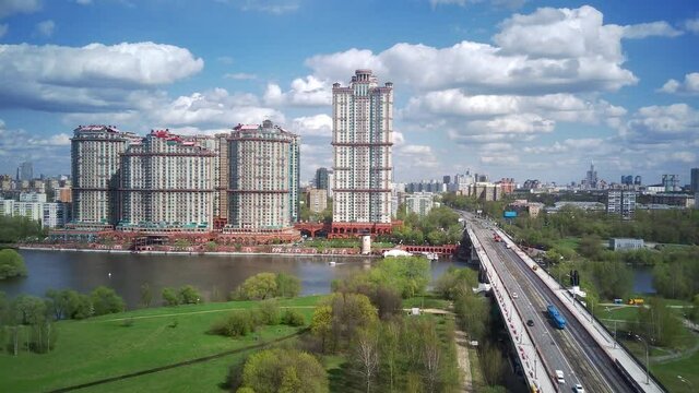Amazing high angle top drone view on Strogino and Shchukino	district which are situated in beautiful green river park.
