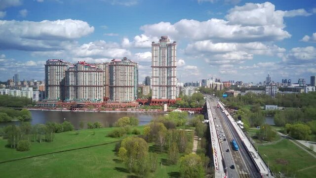Amazing high angle top drone view on Strogino and Shchukino	district which are situated in beautiful green river park.
