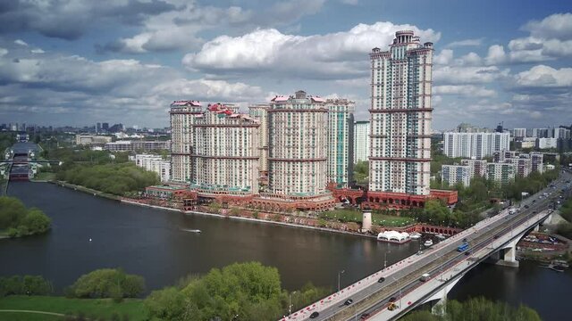 Amazing high angle top drone view on Strogino and Shchukino	district which are situated in beautiful green river park.
