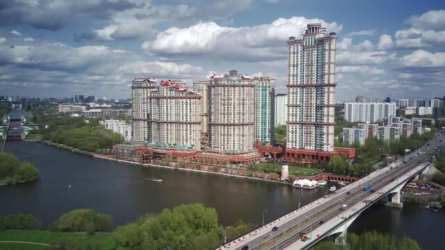 Amazing high angle top drone view on Strogino and Shchukino	district which are situated in beautiful green river park.
