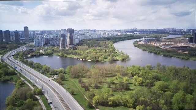 Amazing high angle top drone view on Strogino and Shchukino	district which are situated in beautiful green river park.
