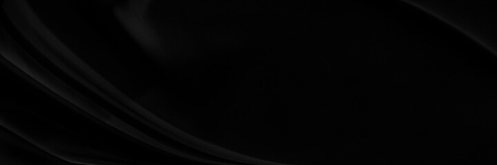 Black gray satin dark fabric texture luxurious shiny that is abstract silk cloth panorama background with patterns soft waves blur beautiful.