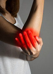 Female suffering from elbow pain.
