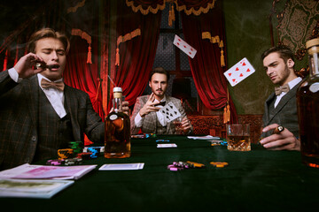 gambler throws cards