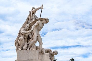 Stone outdoor statue of warriors in front of Altar of the Fatherland monument in Venetia square in in Rome, Italy