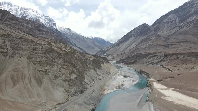 Beautiful Aerial drone footage of a river meeting another river with different color at a sangam in Indus Valley in Ladakh.