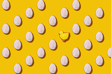Glazed color gingerbread Easter figures - pattern  on a yellow background. Happy Easter. Top View