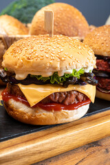 Tasty vegetarian cheeseburgers and hamburgers with round patties or burgers made from grains, vegetables and legumes