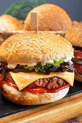 Tasty vegetarian cheeseburgers and hamburgers with round patties or burgers made from grains, vegetables and legumes