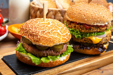 Tasty vegetarian cheeseburgers and hamburgers with round patties or burgers made from grains, vegetables and legumes
