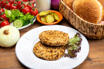 Making vegetarian hamburgers with round patties or burgers made from grains, vegetables and legumes