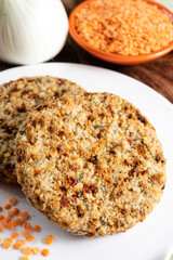 Tasty vegetarian food, burgers made from orange lentils legumes with sun dried tomatoes