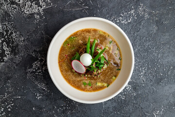 okroshka on kvass on dark concrete table top view