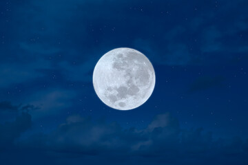 Fototapeta na wymiar Full moon on the blue sky.