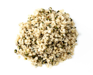 pile of cores of hemp seeds closeup on white