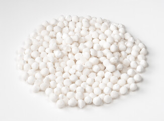 handful of raw sabudana (tapioca sago) on white