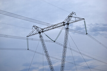 Fototapeta premium High-voltage power line against the blue sky