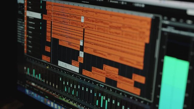 Sound engineer working at music studio with monitors and equalizer mixing gear on screen. Music engineer mixing and mastering tracks. Process of recording editing sounds songs monitor screen